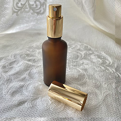 Buy a Little Glass Spray Mister, in Frosted Amber, with a Gold Pump, 50ml at The Surf Haberdashery